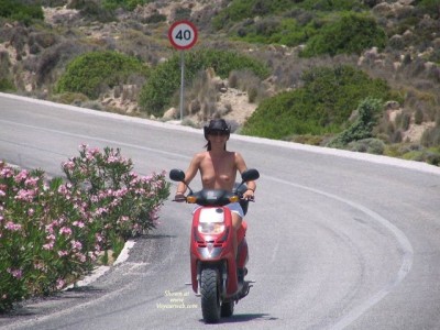 00000D49_driving_motorcycle_topless.jpg
